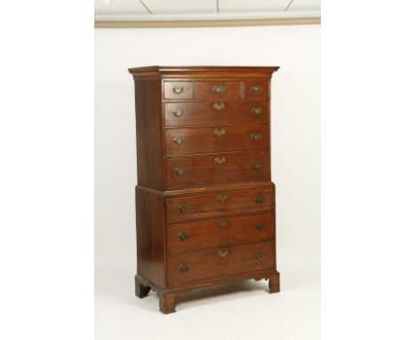 A GEORGE III OAK CHEST ON CHEST, the upper section with a moulded cornice above three small drawers and three long graduated 