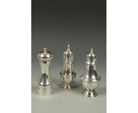 A SUGAR CASTOR of baluster form with high pierced cover, by James Dixon & Sons, Sheffield, 1932, 7" high, another castor and 