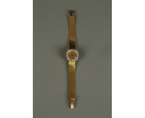 PATEK PHILIPPE: A LADIES 18CT YELLOW GOLD WRISTWATCH, the round dial with four baton numerals, inscribed 'Patek Philippe Gene