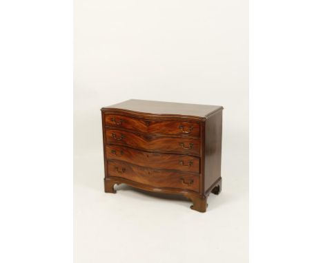 A GEORGE III MAHOGANY SERPENTINE FRONTED CHEST OF DRAWERS, the shaped top with a moulded border above four long graduated dra