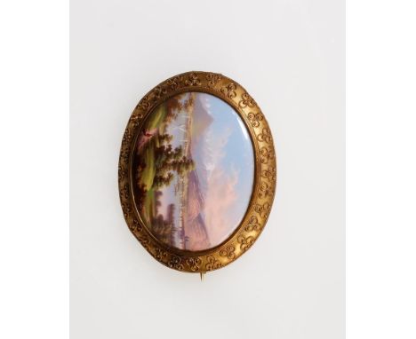 A VICTORIAN ENAMELLED SOUVENIR BROOCH, the oval enamel on copper painted scene depicting Geneva, titled "Geneve" verso, withi
