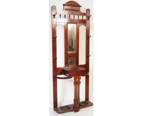 Victorian 19th century mahogany hall stand. The hall stand with a central glove box drawer in front of an upright back compri