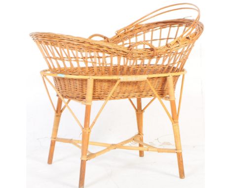 A&nbsp; 19th century aesthetic movement bamboo bassinet / cot / baby cradle. Of oval form with carry handles with woven cane 