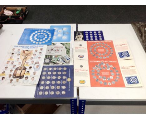 A tray containing three 1970 Esso World Cup coin collection complete sets together with accompanying poster, a Shell Man in F