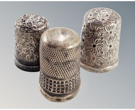 Three hallmarked silver thimbles.