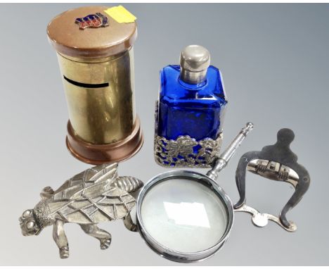 A blue glass and white metal perfume bottle together with a vintage copper and brass trench art money box, a bottle opener in