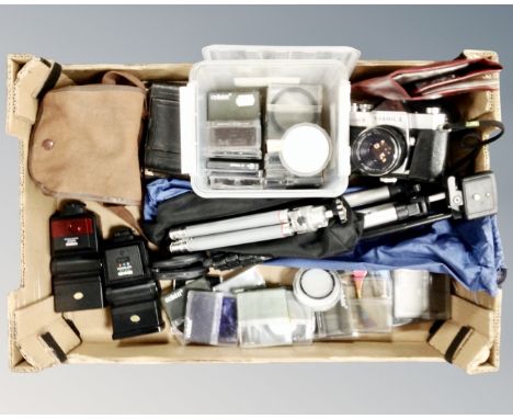 A box containing a Yashica TL Electro-X camera together with further vintage cameras, filters, tripods, Miranda and Cobra cam