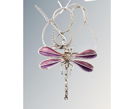 A large white metal plique-à-jour amethyst colour dragonfly brooch.