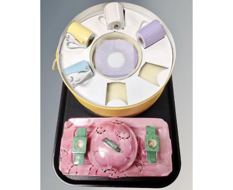 A four piece Myott &amp; Son hand painted Art Deco trinket set together with a part Christian Lacroix coffee set, boxed.