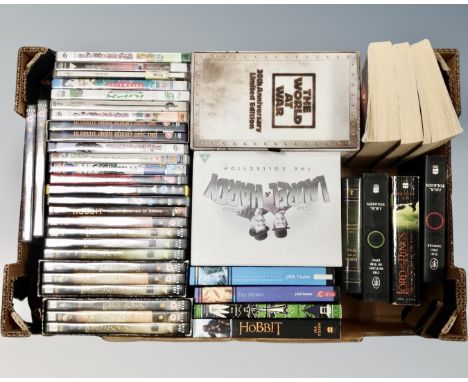 A box containing Lord of the Rings DVD box sets, Laurel and Hardy, The World at War, etc. together with soft back books inclu