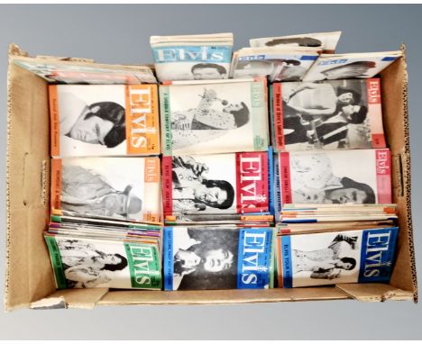 A box containing a quantity of vintage Elvis Monthly magazines.