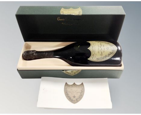 A bottle of Möet Et Chandon Cuvée Dom Pérignon vintage 1992 champagne, in presentation box with booklet.