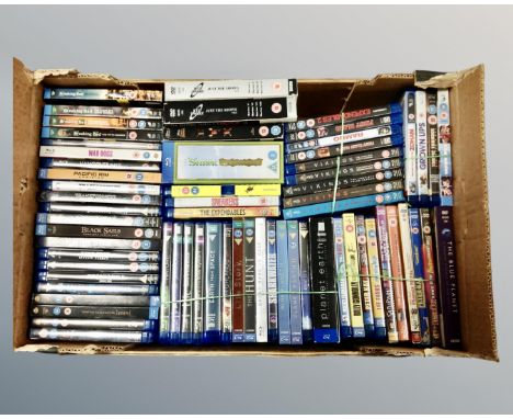 A box containing a large quantity of Blu-rays and DVDs including BBC Earth TV series, Vikings, Breaking Bad, Star Trek, Lord 