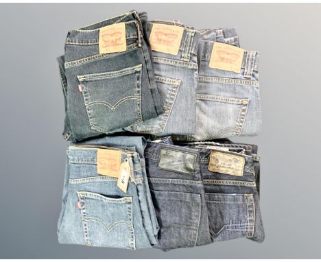A pair of vintage Levi Strauss 514 blue denim jeans, together with two pair of a Levi Strauss 506 blue denim jeans, a pair of