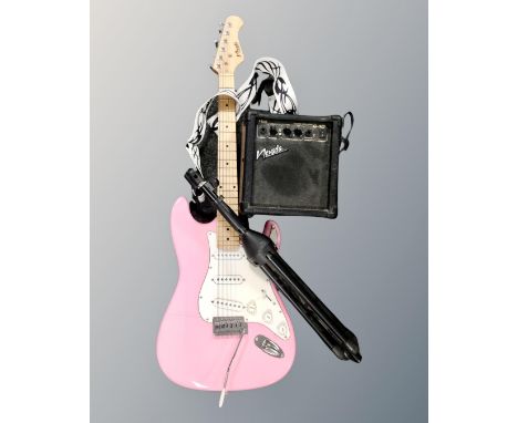 A pink Nevada electric guitar, together with a Nevada G-10 guitar amplifier and a microphone stand.