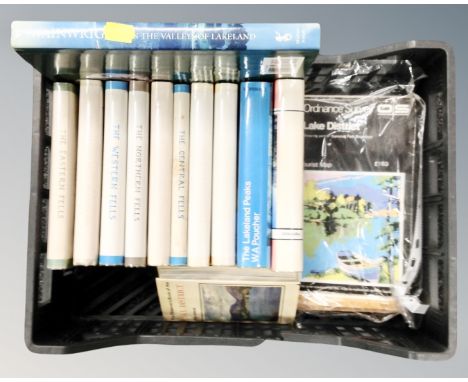 A basket containing a full set of seven Wainwright pictorial books of the Lake District including a first edition, together w