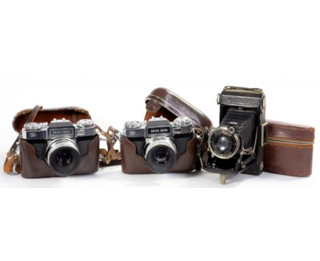 TWO ZEISS IKON CONTAFLEX CAMERAS, EACH IN LEATHER EVEREADY CASE AND A ZEISS NETTAR CAMERA, LEATHER CASE AND AN ALBUM OF TOBLE