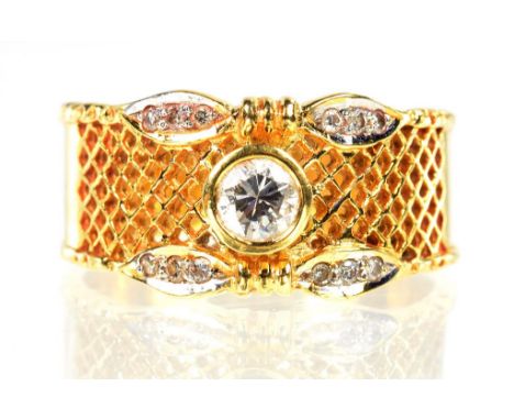 A DIAMOND PIERCED TRELLIS RING, THE GOLD BAND MARKED 18K 750, SIZE N, 6.7G