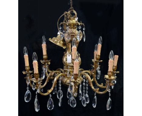 A TWELVE BRANCH GILTMETAL CHANDELIER WITH GLASS PRISM DROPS