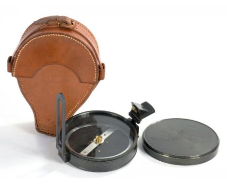 A BRITISH WWII OXIDISED BRASS ARTILLERY PRISMATIC COMPASS BY F. BARKER & SONS, NO. B 52, STAMPED MARKS, BROAD ARROW AND DATE 
