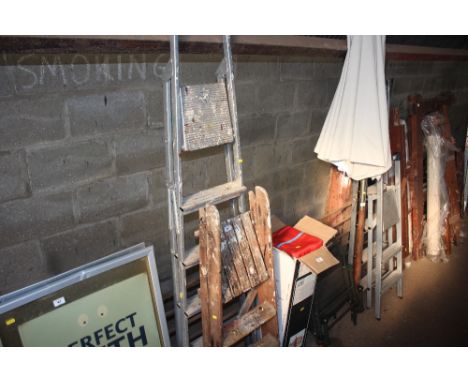 An aluminium step ladder and a set of wooden steps