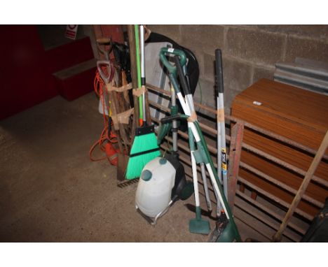 A large quantity of gardening tools to include an electric Flymo stimmer; forks and spades; sprayer etc. 