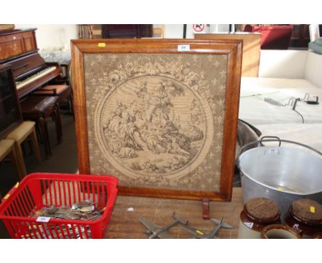 A embroidered fire screen 