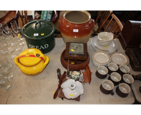 A stoneware crock together with an oak case barometer; a brass trivet stand; carved page turner; a small door stop etc