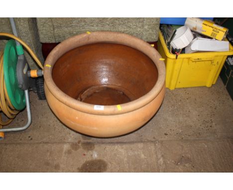 A large glazed terracotta planter 