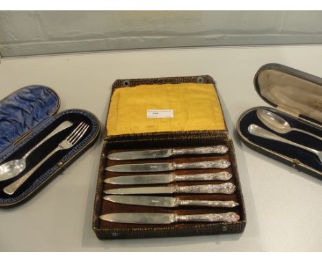 Two cased HM silver fork and spoon sets by J Rodgers; together with a set of six silver handled knives