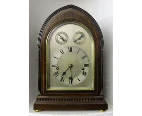 A Bracket Clock:
19th century, mahogany, strung with boxwood, flanked by fluted quarter columns, with a silvered face, the th