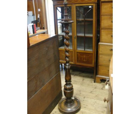 A 1920s oak barleytwist standard lamp