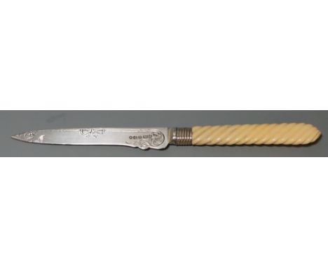 A Victorian silver bladed letter opener with carved spiralling handle, blade engraved with trailing vine and ribbon design, m