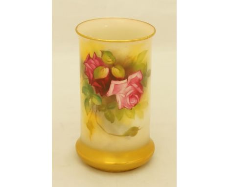 A Royal Worcester cylindrical shaped vase with slightly bellied gilt base the body painted with pink and dark pink roses by M