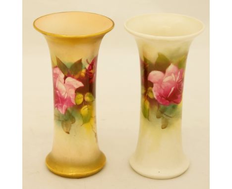 A Royal Worcester waisted spill vase painted with pale and dark pink roses on a white ground, 12cm high, printed mark in gree