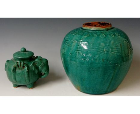 A pottery jar of baluster shape, turquoise glaze, moulded border of star bursts and devices within formal floral and Greek ke