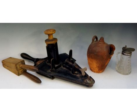 A table top mounted slicer, 43cm high; a terracotta salt pot; a white metal mounted cut glass jug and a wooden lemon squeezer