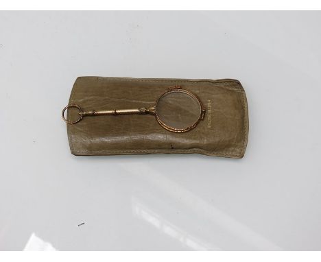 A pair of Victorian longuettes with engine turned handle with loop terminal 