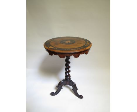 A Victorian rosewood inlaid circular wine table, ebony border decorated with floral sprays above shaped frieze on barley twis
