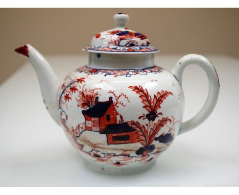 An 18th Century Lowestoft polychrome porcelain spherical teapot with slightly curved spout, painted in iron red and gras bleu
