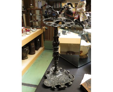 A Victorian umbrella and stick stand with deer head finial, scroll and foliate design, 70cm tall 