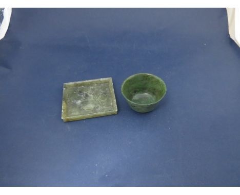 A carved jade spinach bowl, 4cm tall, together with an embossed dish (2)