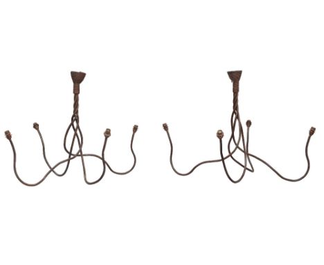 Designer Unknown, a pair of modern iron four light chandeliers, circa 2000, patinated iron, each 80cm high (2) It is the buye
