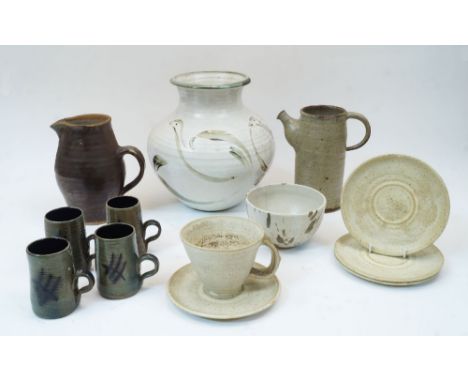 A group of studio pottery, 20th century, to include a Leach Pottery stoneware jug with brown glaze, mark for St Ives and impr