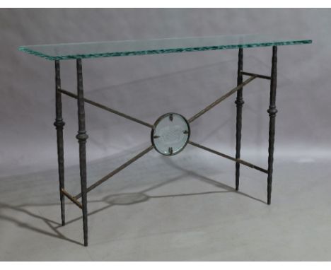 Property from the estate of the late David Cornwell, best-known as the author John Le CarréA modern glass top and wrought iro