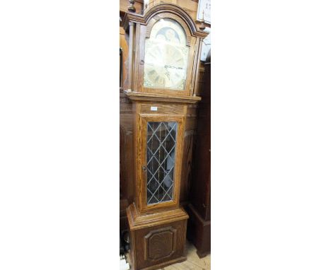 A modern oak cased longcase clock with moon roller