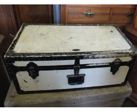 A white and black painted cabin trunk