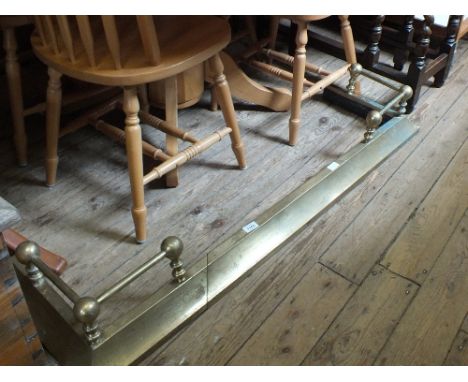 A brass rail fender