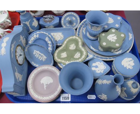 Wedgwood Jasperware, of twenty five pieces including lilac, pink and green ashtrays, powder blue clock vases:- One Tray.