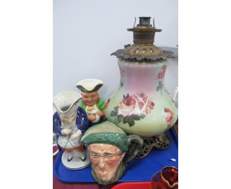 A Late XIX Century American Oil Lamp, the opaque glass bulbous body decorated with pink roses on a shaded green/pink ground, 